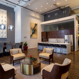 a clubroom with chairs and a kitchen