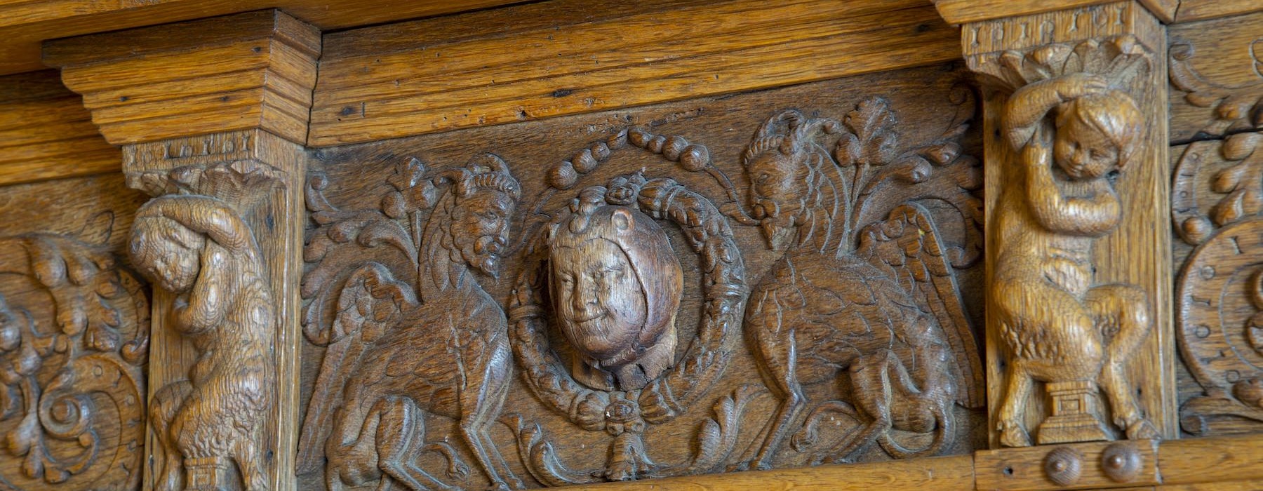a group of carvings on a wood surface