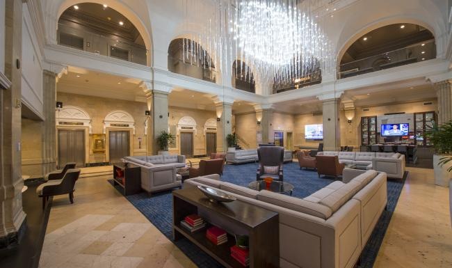 a large room with a large chandelier and a large bar