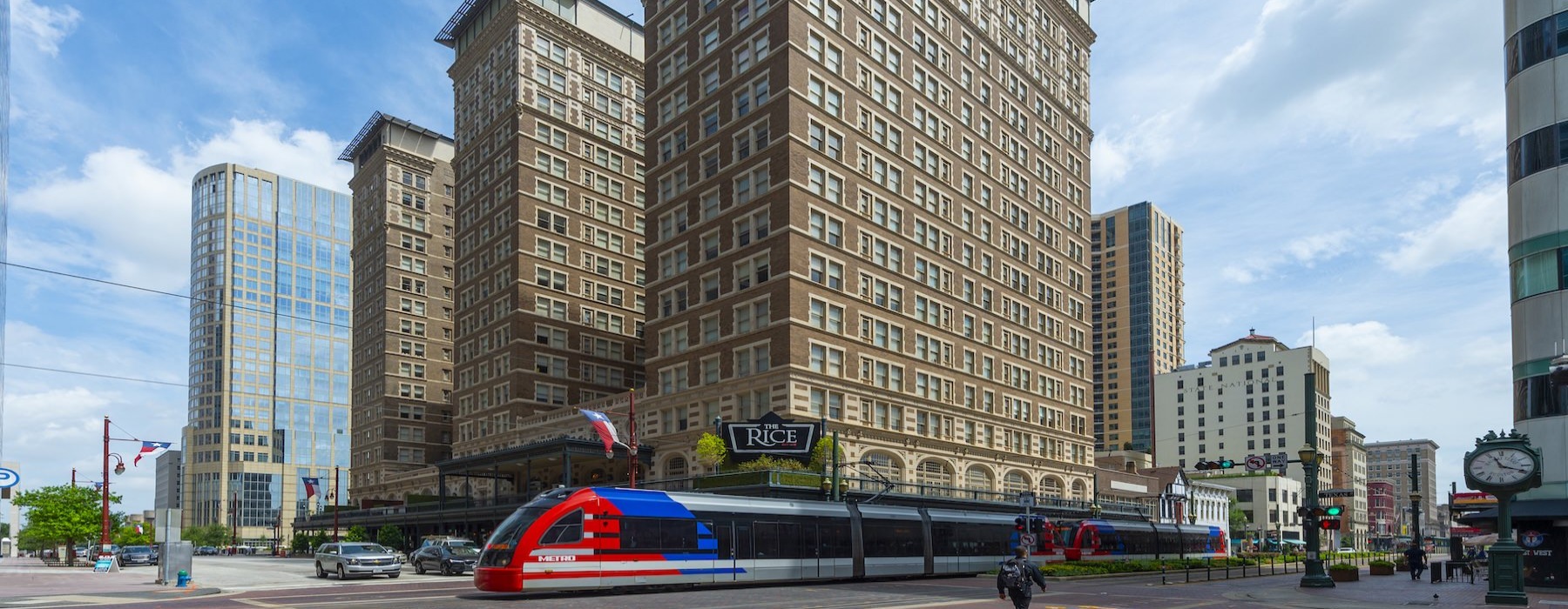 a large building with a train in front
