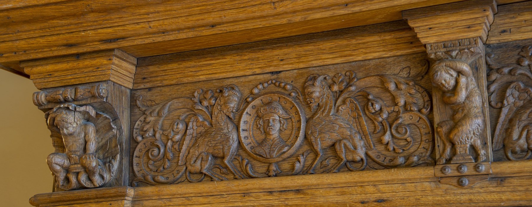 an ornate wooden mantle