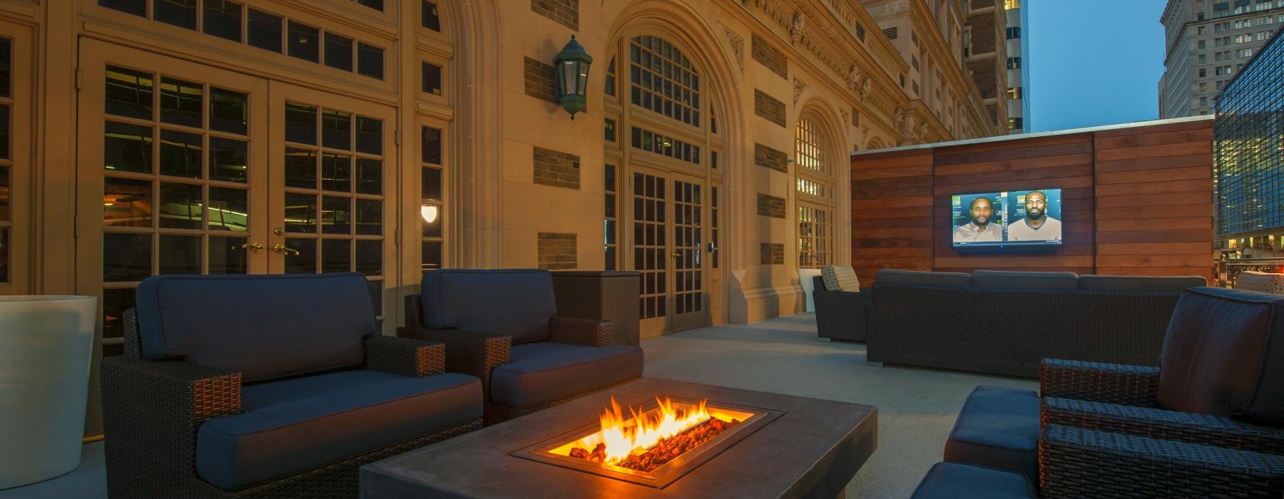 a room with a fireplace and chairs