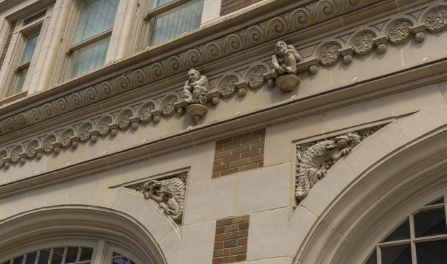 a building with statues on the roof